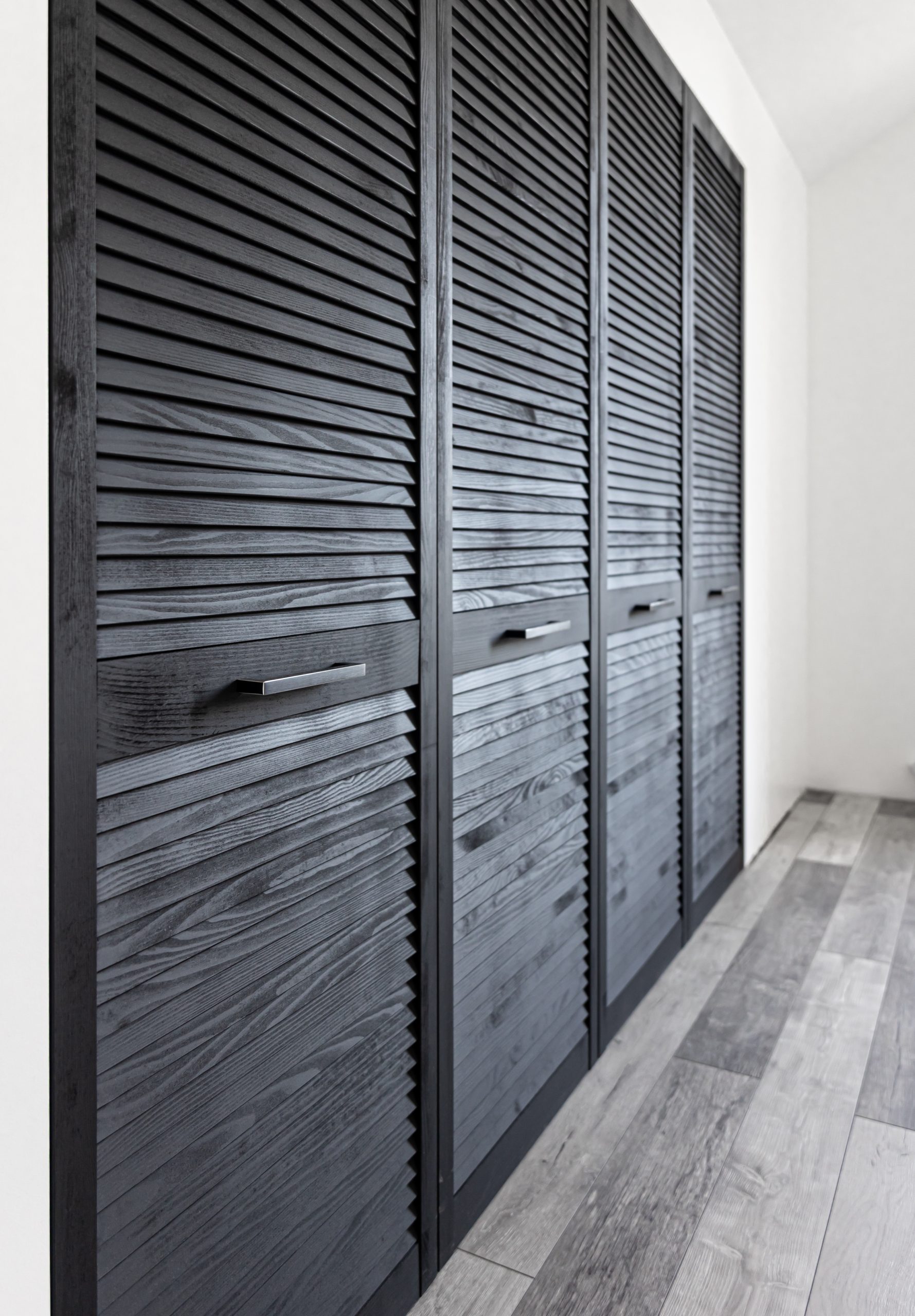 Textured Wooden Black Cabinet In The Interior Of The Room.